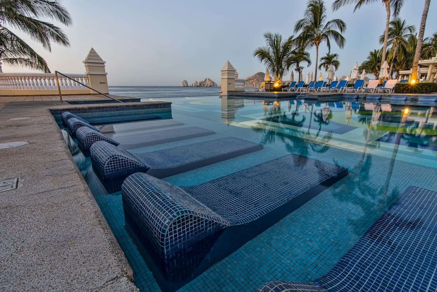 Tiled in-water loungers on a shallow tanning ledge